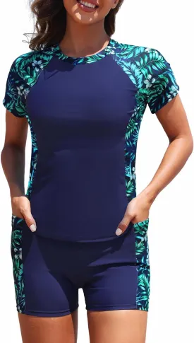 Daci Women's Two Piece Rash Guard - Short Sleeve Swim Shirt with Built-in Bra and Shorts with Pockets